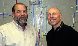 Jallans, left, and Cook found the switching board they saved from the old Chalmette office invaluable during restoration.